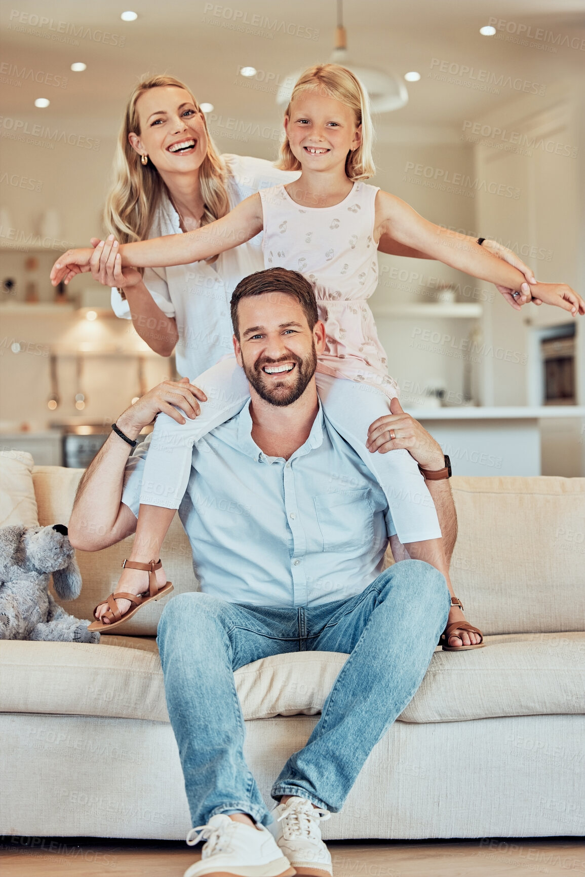 Buy stock photo Fun, love and portrait with family on sofa in living room of home together for bonding or child development. Energy, flying or smile with mom, dad and daughter in apartment for excitement or trust