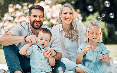 Buy stock photo Smile, family and blowing bubbles in garden at home with fun, bonding and support with care. Parents, kids and happy on portrait for child development or growth in outdoor with love and learning