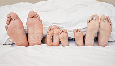 Buy stock photo Family, feet and sleeping in bedroom in home for relax, comfort and safety in bonding or together. People, parents and children with rest, blanket and morning in apartment for love, nap and peace