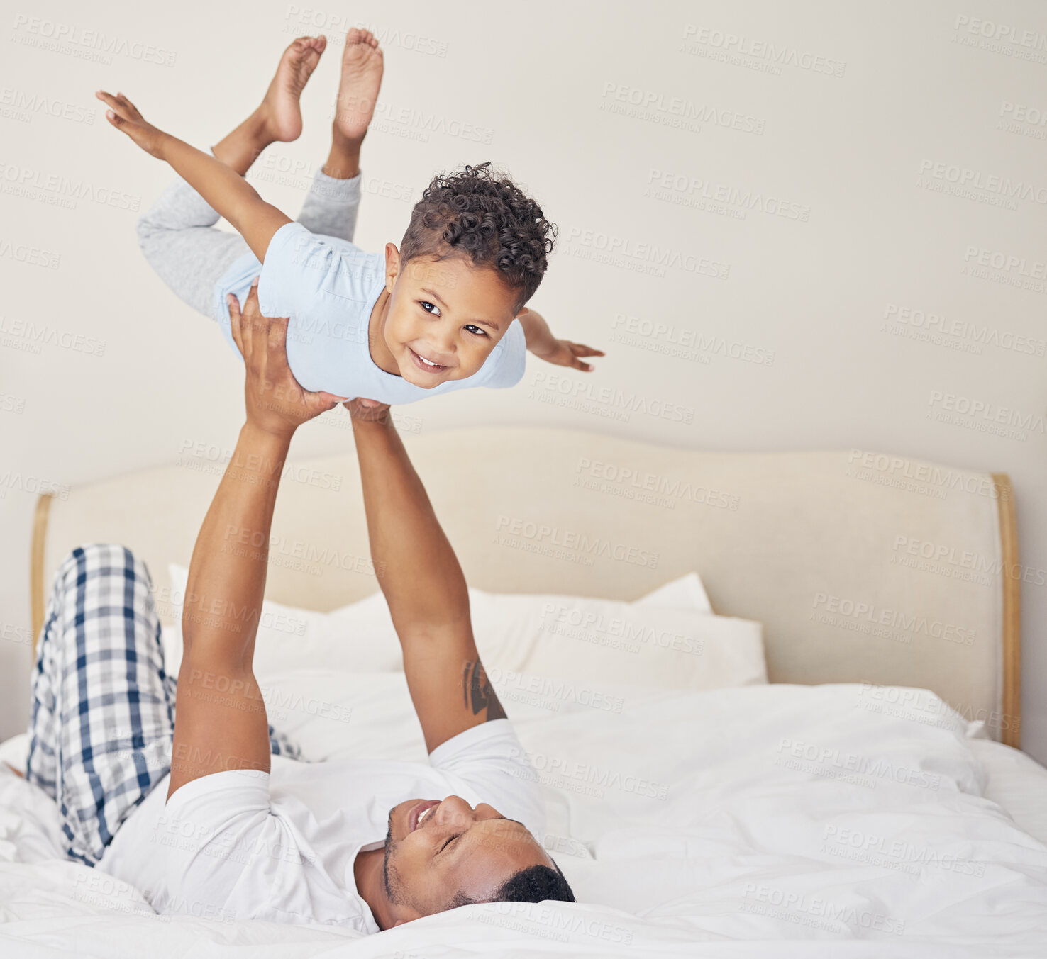 Buy stock photo Father, boy and airplane on bed with child for bonding, happiness or playing together in bedroom. Morning, man parent and young kid with balance for family fun, support or lift in air of home