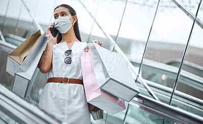 Buy stock photo Woman, shopping bags and mask for protection in epidemic as consumer in mall for fashion, style or trend. Female person, mobile and phone call as stylist, influencer or blogger in retail or store