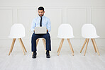 Fullbody asian businessman waiting for interview and using laptop. Applicant sitting alone, browsing internet on technology. Professional candidate in line for job opening, vacancy, office opportunity