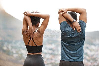 Buy stock photo Couple, stretching and arm warm up for exercise, fitness and race training outdoor with back. Sport, group and wellness with start and hill at sunrise with workout and relax morning with city view