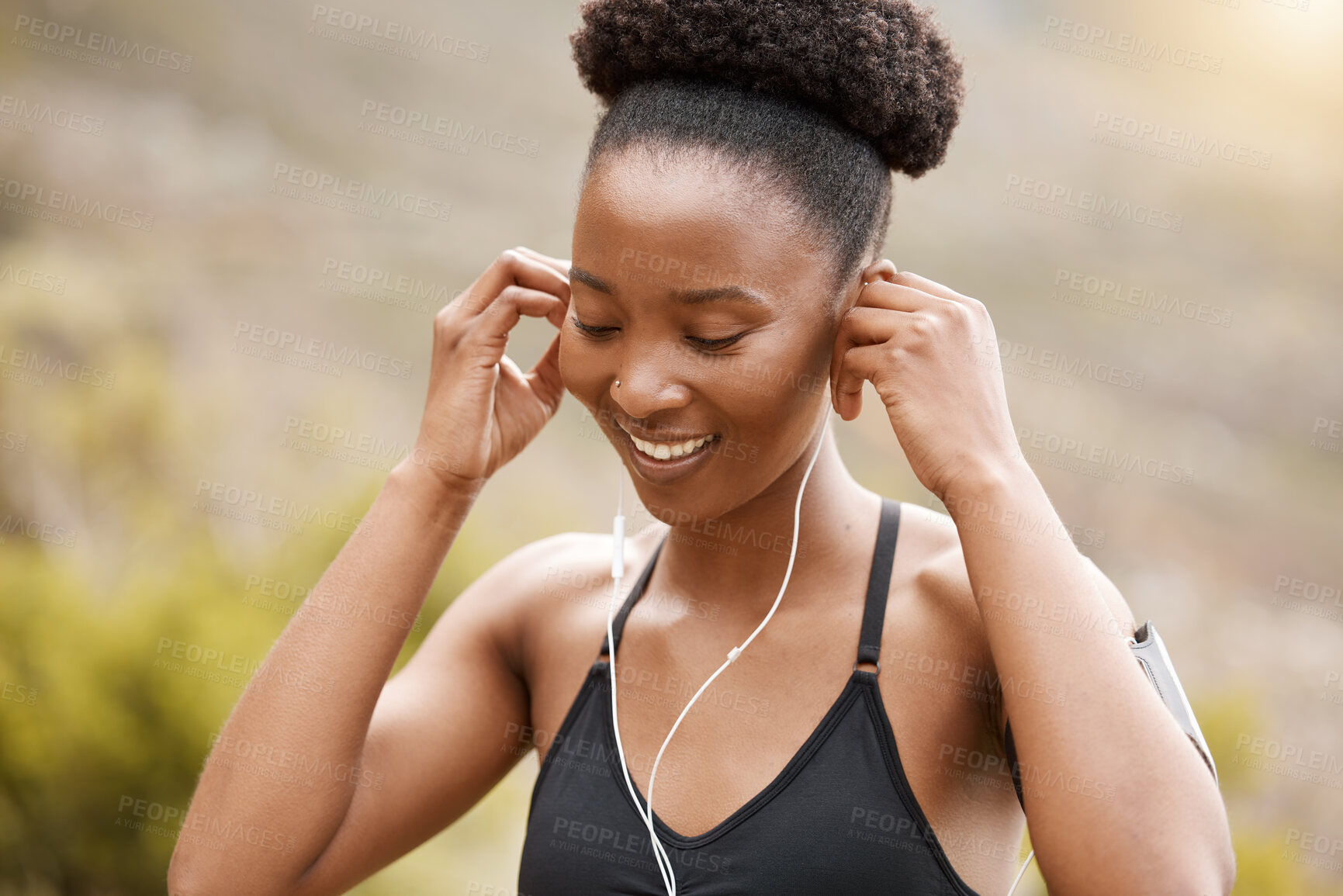 Buy stock photo Fitness, earphones and black woman in nature for morning cardio, running or training at sunset with music. Exercise, wellness and runner streaming podcast, audio or playlist for workout motivation