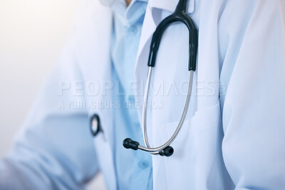 Buy stock photo Healthcare, closeup and person with stethoscope for cardiology, wellness and patient care in studio. Medical professional, doctor and scrubs with expertise for medicine, consultation and evaluation