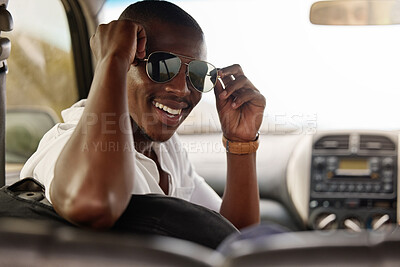 Buy stock photo Sunglasses, travel and black man with smile in car for outdoor adventure, holiday and summer journey. Relax, male person and happy with drive in vehicle for road trip, vacation or tourism in Kenya