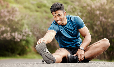 Buy stock photo Outdoor, man and stretching leg for fitness, training and exercise for wellness with balance. Nature, road and Indian person or runner with warm up, preparation and getting ready for sports challenge