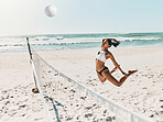 Woman, beach and volleyball for fitness, health and exercise on vacation in the summer. Girl, sports and ocean play with ball on sand to workout for wellness in sunshine on holiday in Cancun, Mexico