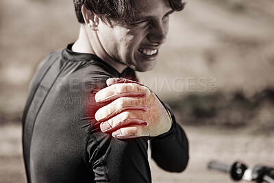 Buy stock photo Biker, man and shoulder pain after training, injury and inflammation with torn muscle, strain and outdoor. Male rider, athlete and sportsman with stiffness, accident and inflamed joint after practice