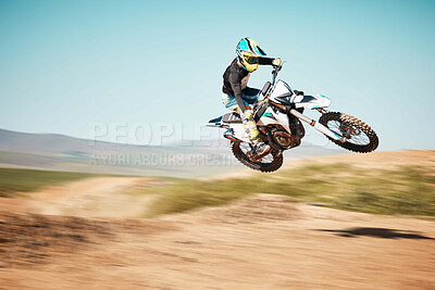 Buy stock photo Motorcross, air jump and offroad sports with motion blur, speed challenge or desert. Driver, cycling and stunt on dirt track, competition and motorbike performance on adventure course for fast action