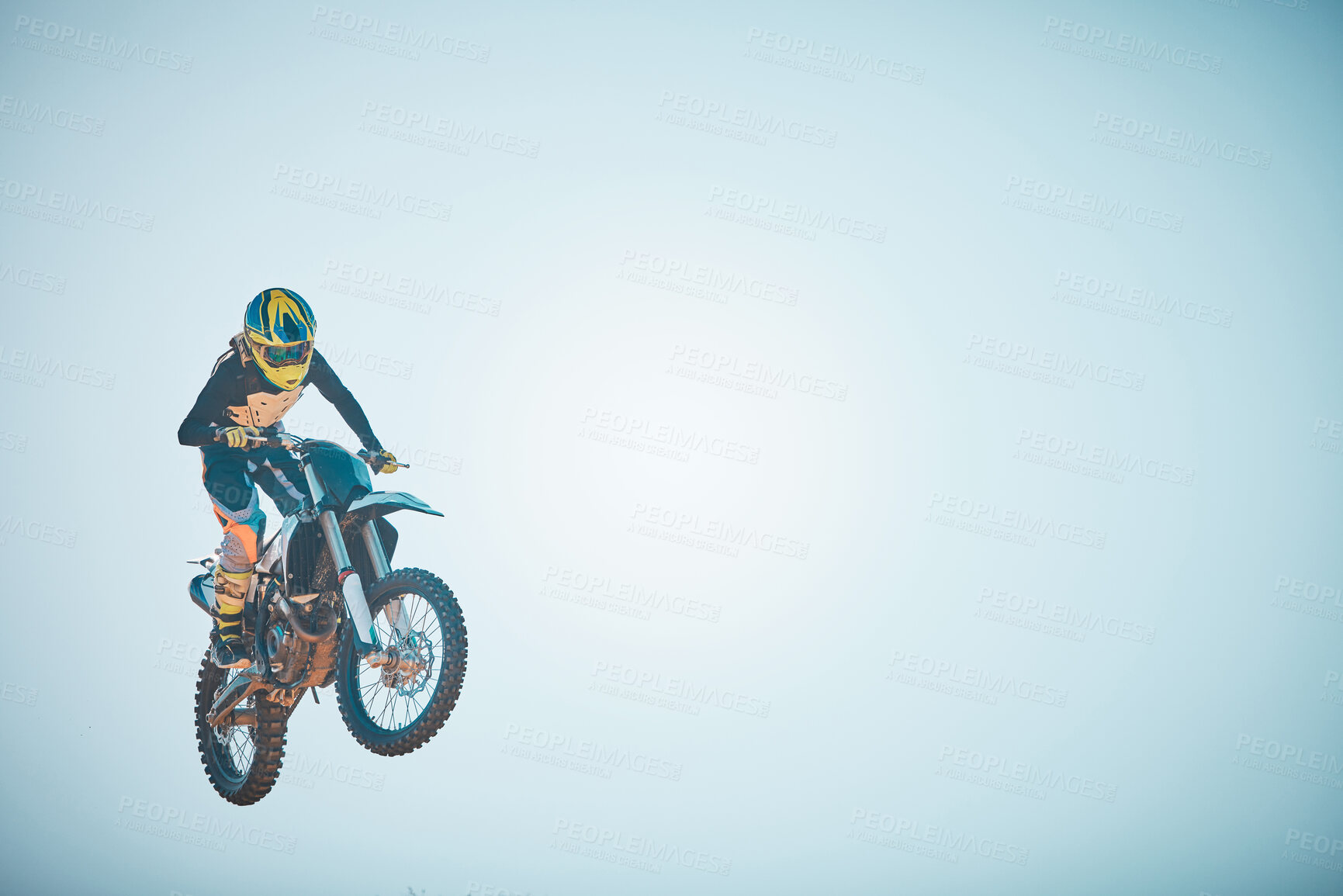 Buy stock photo Bike, motorcycle and jump on blue sky mockup for speed challenge, sports and fearless risk. Driver, air stunt and driving with adrenaline in competition performance, adventure and fast motorbike race