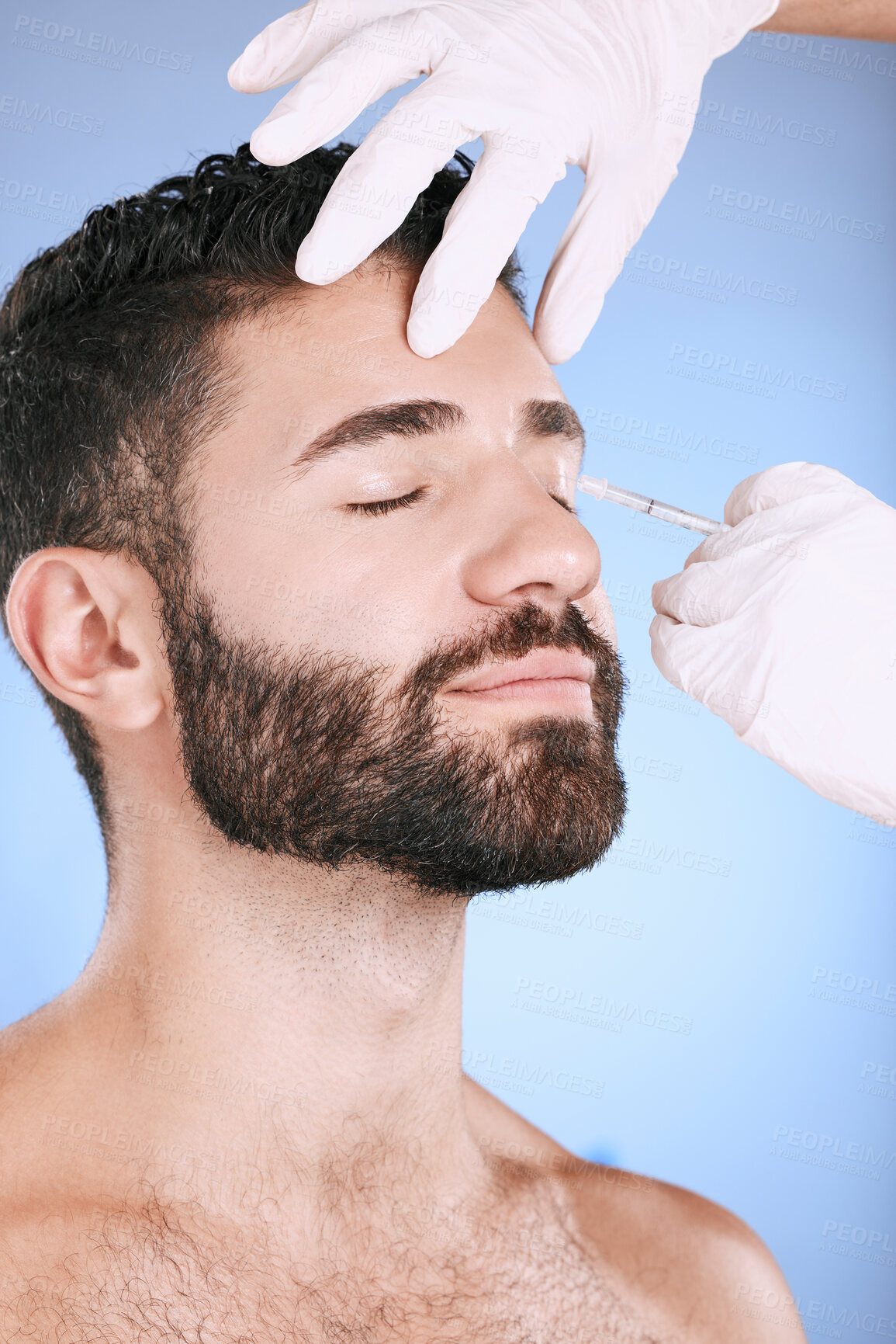 Buy stock photo Injection, man and studio for skincare, collagen wellness and beauty process at salon. Cosmetics, face and needle of plastic surgery, botox and facial change of aesthetic prp, eyes or blue background