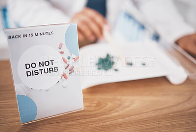 Buy stock photo Employee break sign, pharmacy and shop poster closeup of an busy board in healthcare store. Medical, wellness and doctor practise with a do not disturb placard and billboard on worker desk at clinic