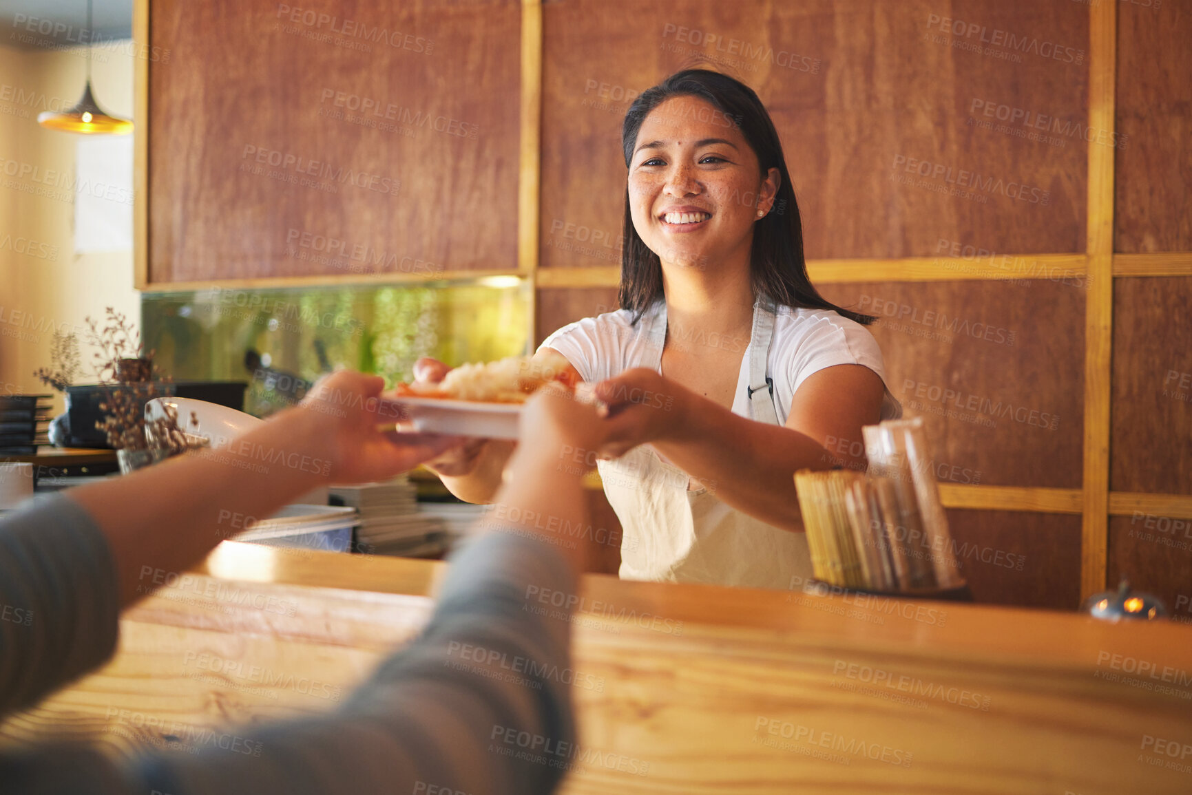 Buy stock photo Sushi, restaurant worker hand and woman smile from food and Asian meal with server. Happy, female waiter or chef working with fish and rice for lunch order with cooking in Japanese bar for service