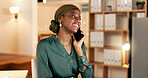 Phone call, night and black woman in international mobile communication, global client or office discussion. African virtual assistant or Nigeria business person talking on smartphone and typing on computer