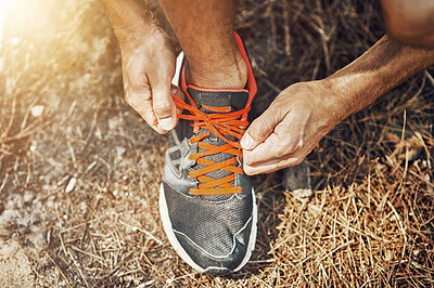 Buy stock photo Man, tie laces and fitness in forest, getting ready and prepare for exercise or workout on ground. Male person, foot and fasten sneakers for sports training, running shoes and athlete for cardio