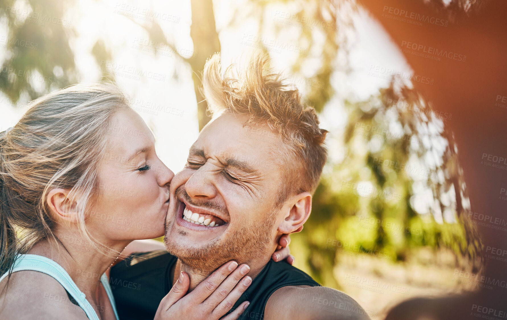 Buy stock photo Couple, selfie and exercise with kiss, nature and fitness together with photo for social media. Smile, happy and excited from love, bonding and workout in woods with profile picture in forest