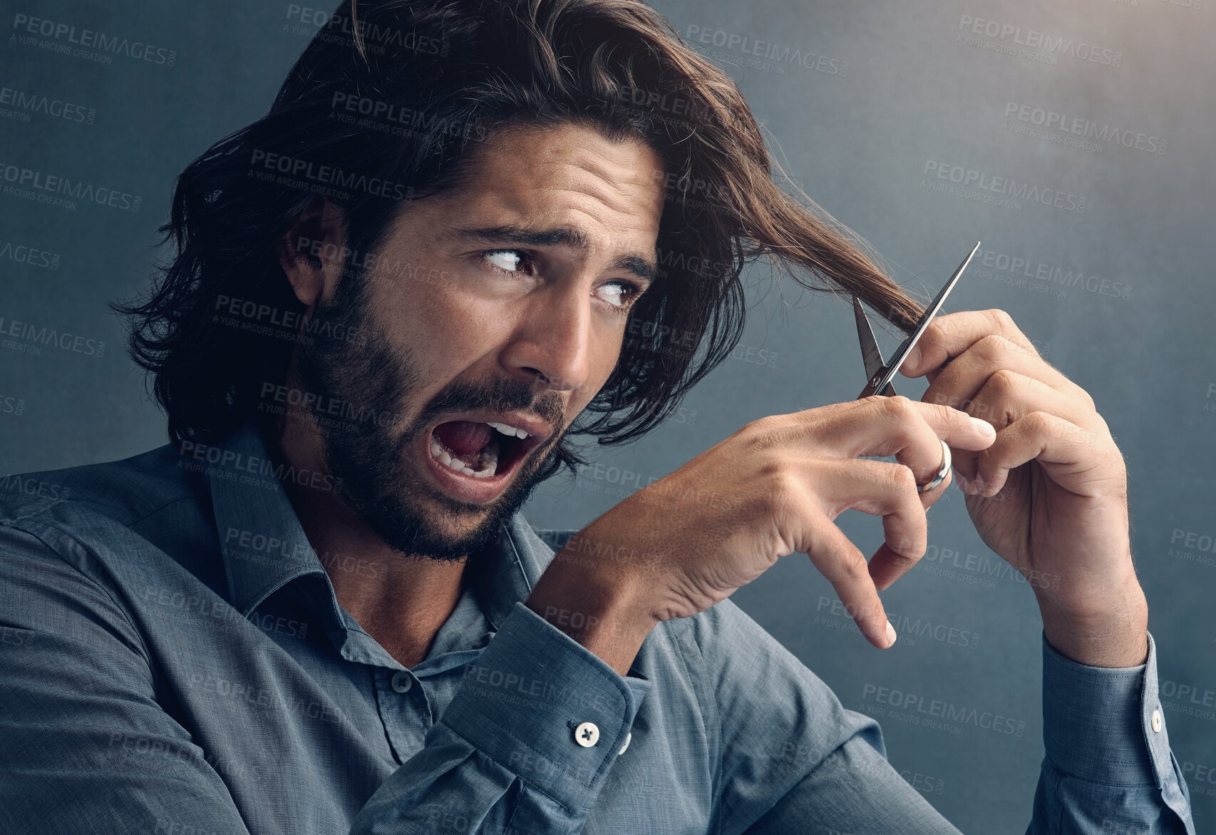 Buy stock photo Trim, hair humor and man with scissors for grooming, facial cleaning and funny joke on grey studio background. Barber, mistake and face of scared model trimming fear for comedy cosmetic fail look