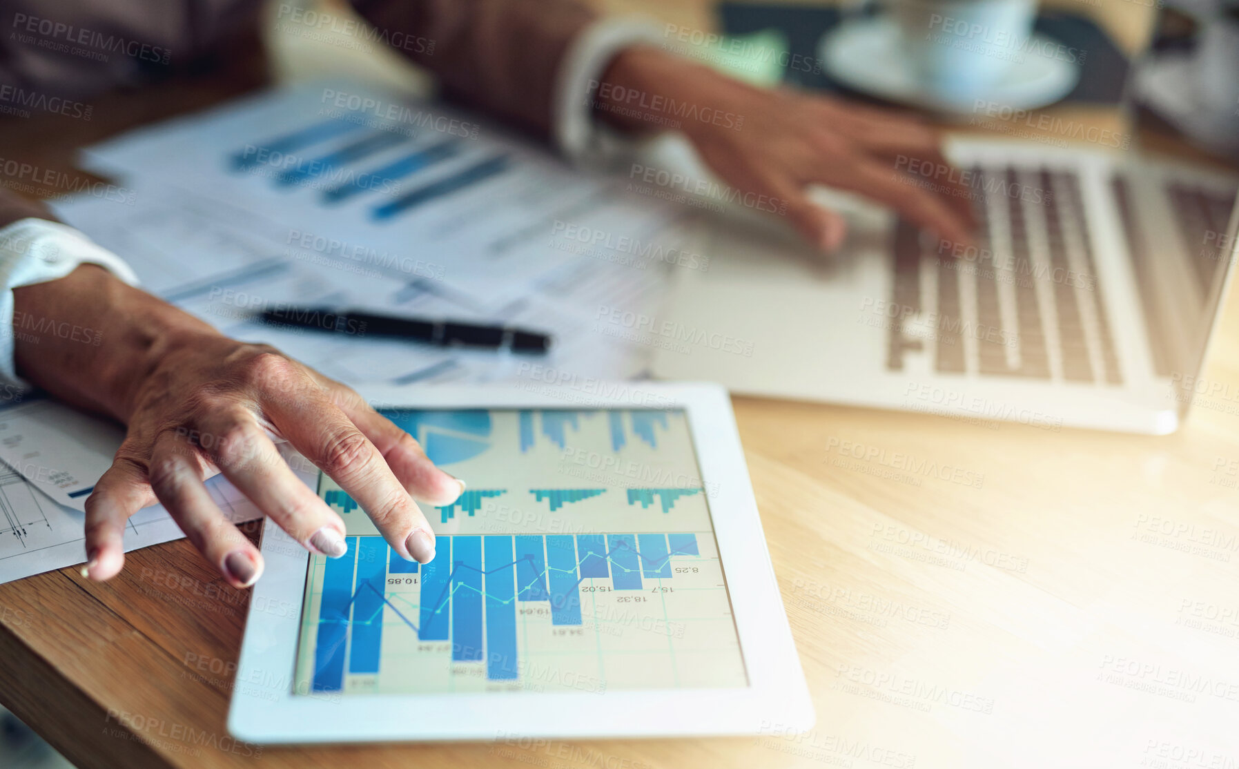 Buy stock photo Hands, screen and businessperson with data on tablet at desk for graphs, charts or digital statistics in office. Lens flare. laptop and employee for kpi update, economy growth or review documents