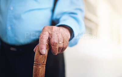 Buy stock photo Retirement and senior man with walking stick in closeup for balance, support and wellness in old age. Health and male person with disability and cane for help, rehabilitation and recovery from stroke