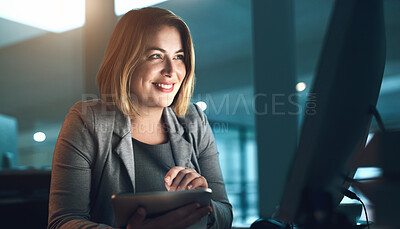 Buy stock photo Happy woman, tablet and night with computer for deadline, project or tasks on agenda at office desk. Female person or web designer working late with smile on technology for innovation at workplace