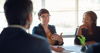 Buy stock photo Talking, people and businesswoman in meeting, discussion or group conversation for investment. Teamwork, paperwork or financial investors planning for strategy, feedback report or project funding