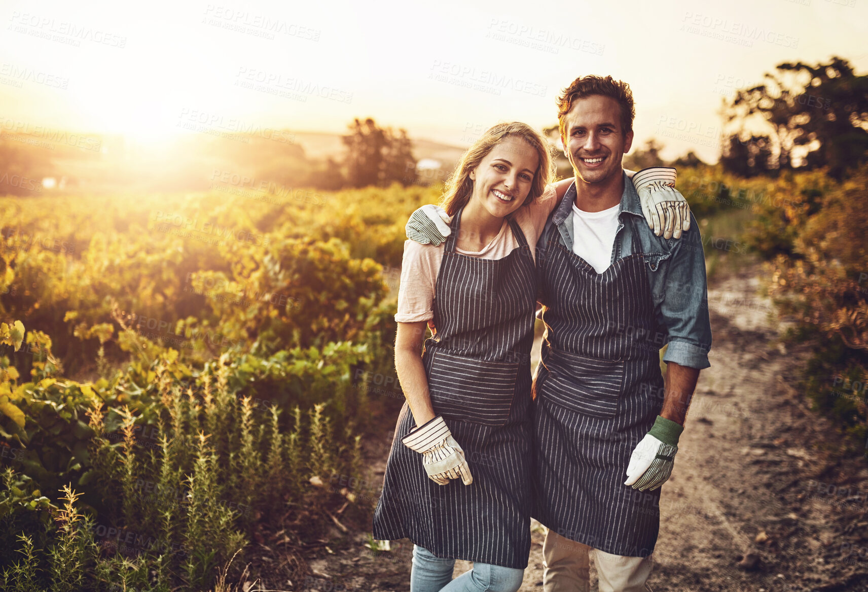 Buy stock photo Love, hug and farming as couple on countryside for agriculture, growth and wine. Teamwork, bonding and portrait with man and woman in grape field for vineyard, sustainability and environment