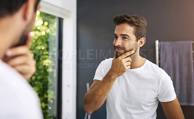 Buy stock photo Skincare, mirror and happy man in house with hands on face for beard, growth inspection or facial hair. Bathroom, check and male person with reflection for cleaning, beauty glow and grooming results