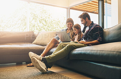 Buy stock photo Happy, laptop and family home on sofa with child, man and woman relax together in living room. Parents, girl and browsing on computer for app game, watch video online and website for streaming movie