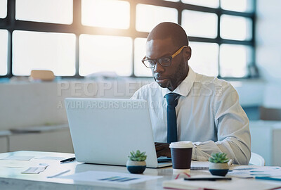 Buy stock photo Finance, documents or businessman with laptop in office for planning, research or tax, savings or review. Fintech, investment or African accountant with glasses for startup, accounting or sale profit