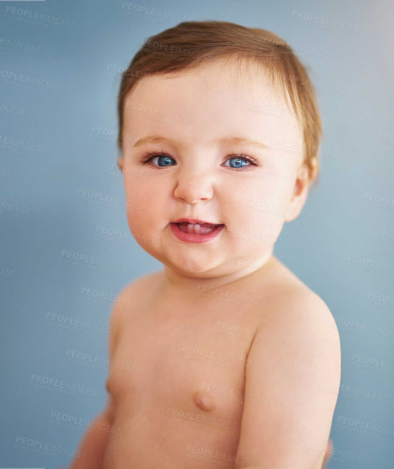 Buy stock photo Baby, portrait and infant with smile in studio for skincare, wellness and naked for morning routine. Child, girl and happy face with wellbeing, innocent and healthy kid with relax on blue background