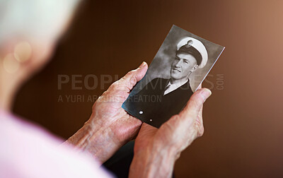 Buy stock photo Senior hands, holding and photo of husband for memory with love, remembering and nostalgia. Loss, people and emotional connection in home with self reflection in closeup with vintage picture.