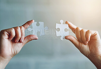 Buy stock photo Hands, puzzle and connection with teamwork for support or business partner with merger. Collaboration, synergy and unity with link for people or problem solving in workplace, innovation and closeup