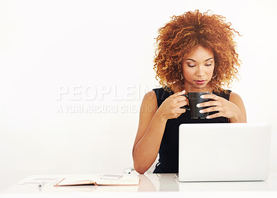 Buy stock photo African woman, laptop and coffee in studio by space for mock up with thinking by white background. Person, computer and drink in tea cup with reading, research or notebook for job at creative agency