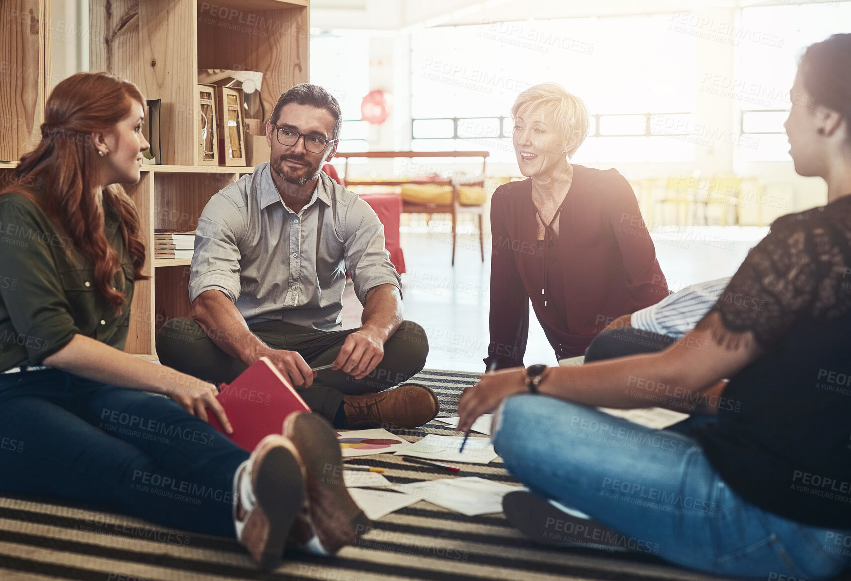 Buy stock photo Group, circle or business people sitting on floor for collaboration, documents and notes for ideas. Teamwork, huddle or meeting with manager for company plan, discussion for strategy in office