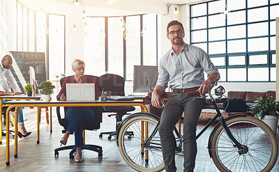 Buy stock photo Bike, green business and portrait with employee in office for carbon footprint or eco friendly work. Leadership, sustainability or transport and man in workplace with bicycle for net zero commute