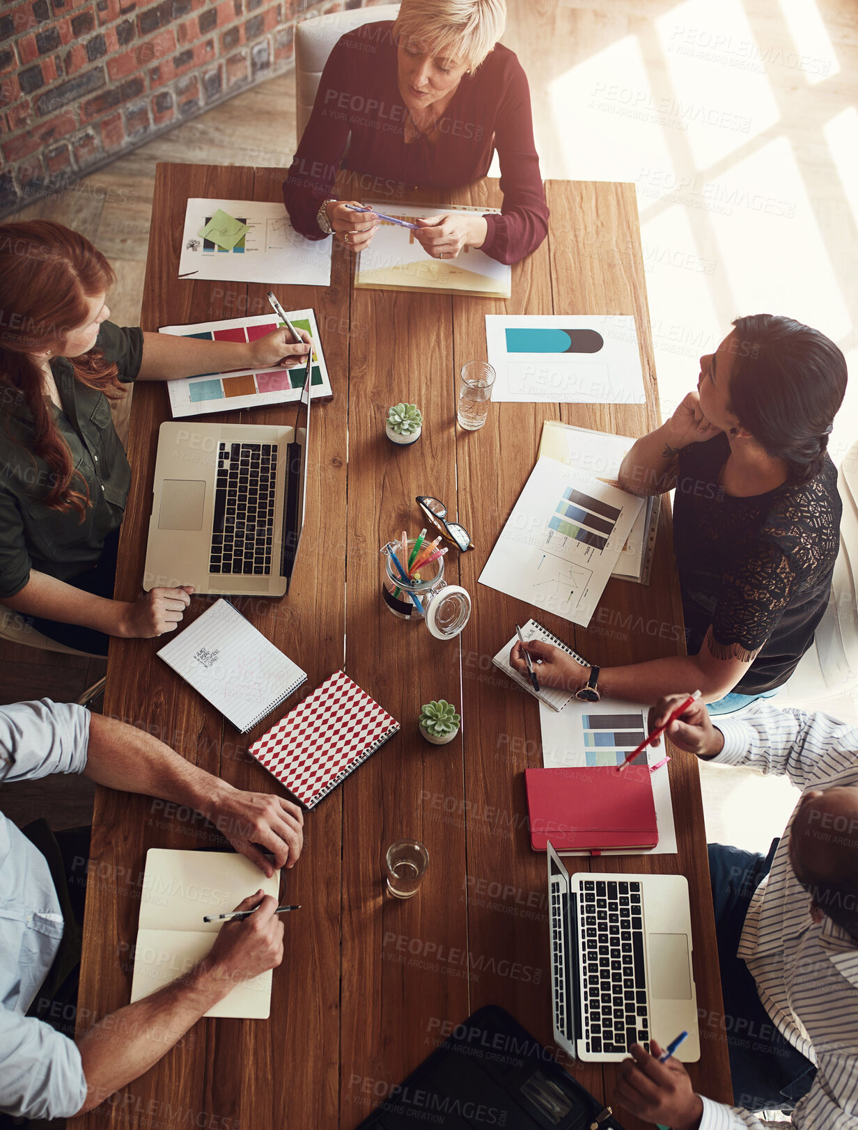 Buy stock photo Top view, planning and team of business people in meeting for discussion, strategy or brainstorming ideas in startup. Above, collaboration and group in training with finance manager for data analysis