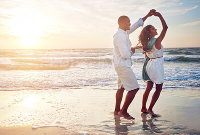 Buy stock photo Couple, celebration and dance on beach with outdoor romance, holiday and vacation by ocean sunset. Happy people spinning and holding hands with love, fun or travel on anniversary or valentines day