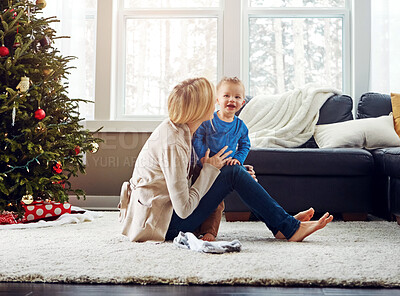 Buy stock photo Mom, boy and child on floor by Christmas tree with playing, bonding and care with connection in family home. Woman, mother and toddler on carpet for games, love and festive celebration in lounge