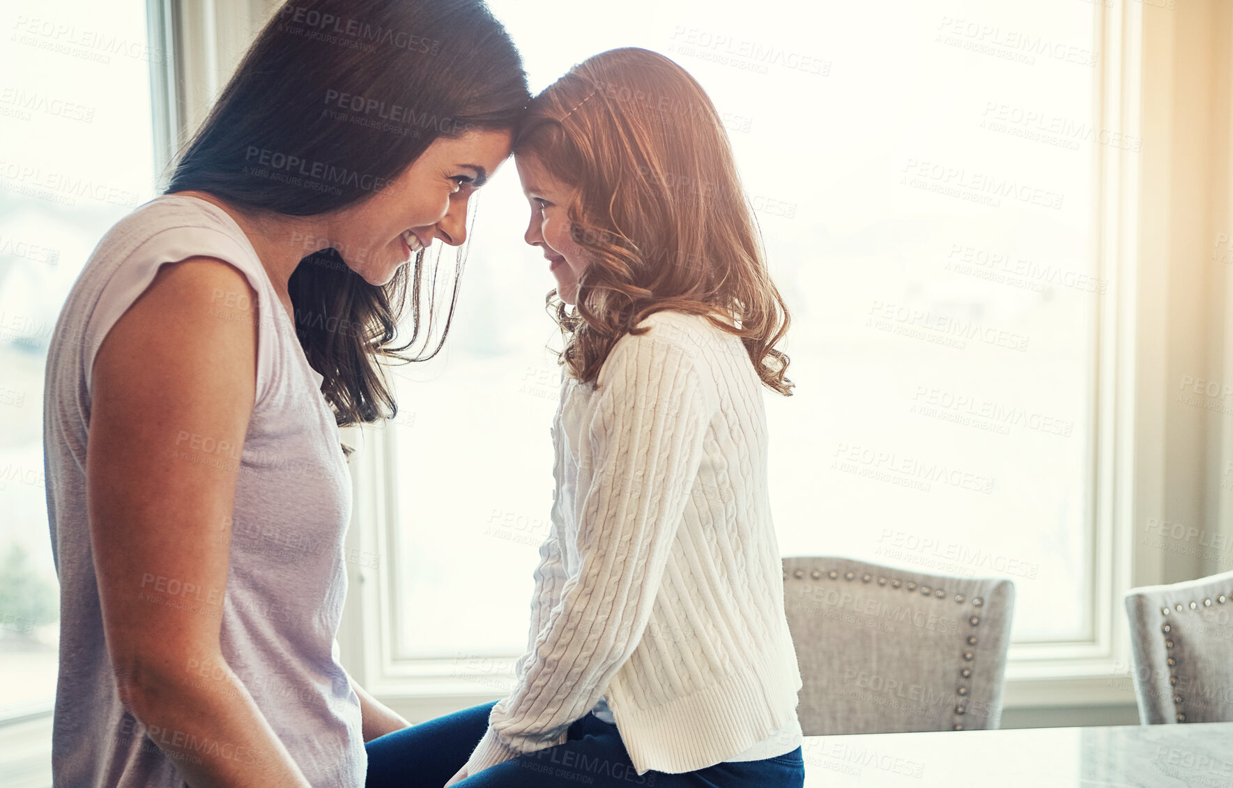 Buy stock photo Mother, child and bonding with love on kitchen at house together, conversation or connection for morning gossip. Smile, woman and girl with support, care or relax for staring game of development