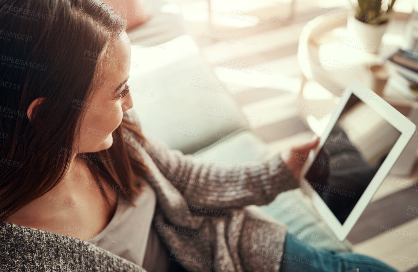 Buy stock photo Happy, tablet and woman on sofa to relax for social media, online shopping and internet in home. Apartment, living room and person on digital tech for reading website, news and research on weekend