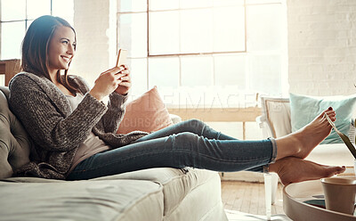 Buy stock photo Relax, smile and woman with phone on sofa at home for social media, communication and notification. Happy, person and thinking with tech in living room for internet, connection and online dating app