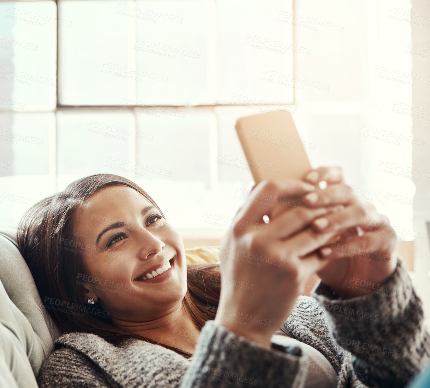 Buy stock photo Phone, search and girl on a sofa with social media, streaming or reading subscription, sign up or service info at home. Smartphone, app and person in a living room with online dating, chat or scroll