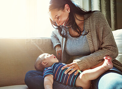 Buy stock photo Happy, mother and baby on sofa relax on weekend for love, bonding and relationship development in home. Care, woman and child together on couch in summer for safety, support or playing in living room