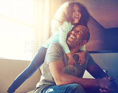 Buy stock photo Happy, man and kid with hug on sofa in living room for love, care and gratitude on fathers day. Playful, black family and little girl with dad at home for weekend, bonding and support in childhood