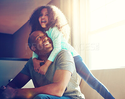 Buy stock photo Dad, girl and happy with piggyback on sofa at home for fun, bonding and care with trust. Parent, man and kid with smile for playing on couch to support, relax and child development with daughter