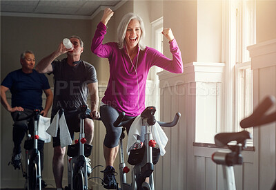 Buy stock photo Fitness, cycling and happy woman in gym for celebration, achievement and goal victory. Spinning class, senior people and female athlete as winner, training and exercise success with workout machine