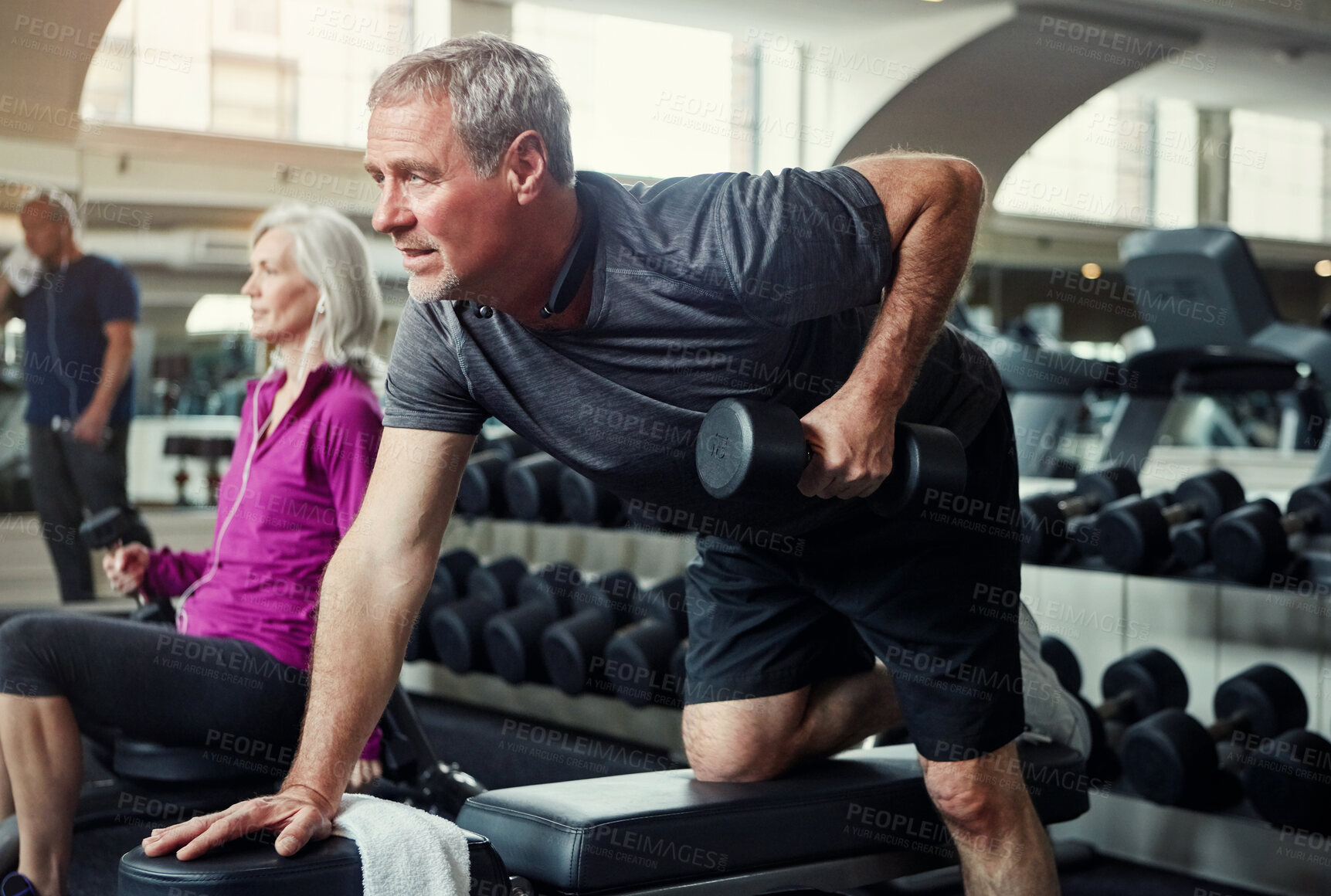 Buy stock photo Fitness, dumbbell and mature man at a gym for wellness, training and  morning cardio, exercise or routine. Health, workout and weightlifting for balance, mobility or commitment to healthy body