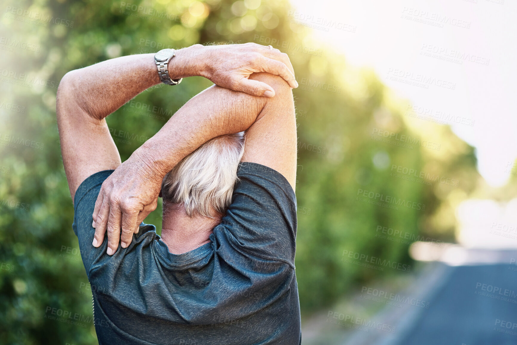 Buy stock photo Fitness, senior and man stretching arm in road for morning workout, wellness routine or warm up. Back, outdoor and elderly person for muscle flexibility, running exercise or getting ready in London