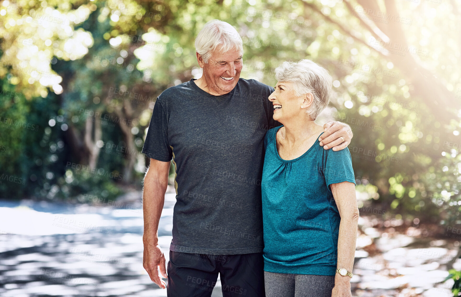 Buy stock photo Outdoor, hug and senior couple for fitness, exercise and walking with happy people in retirement. Marriage, elderly man and old woman in nature for workout for health benefits, wellness and cardio